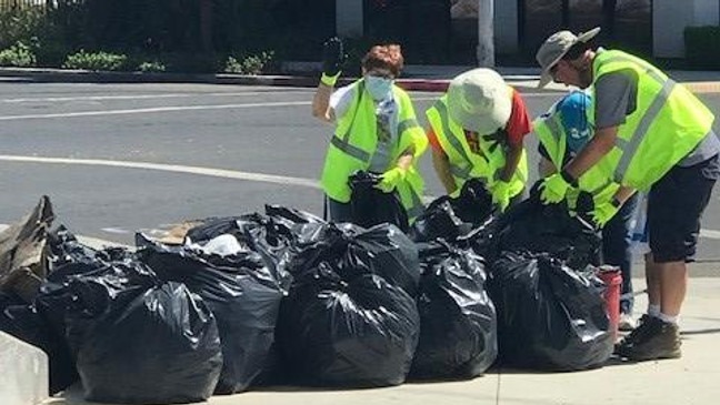 Fresno based Rotary clubs pick up trash.